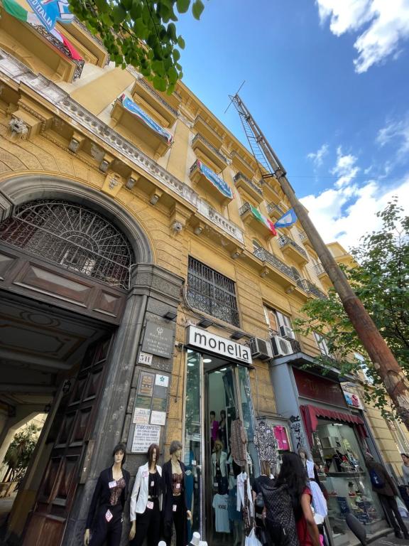 a store front of a building with people walking outside at B&B La Canzonetta in Naples