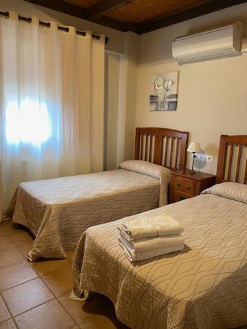 Postel nebo postele na pokoji v ubytování LA SOCIEDAD