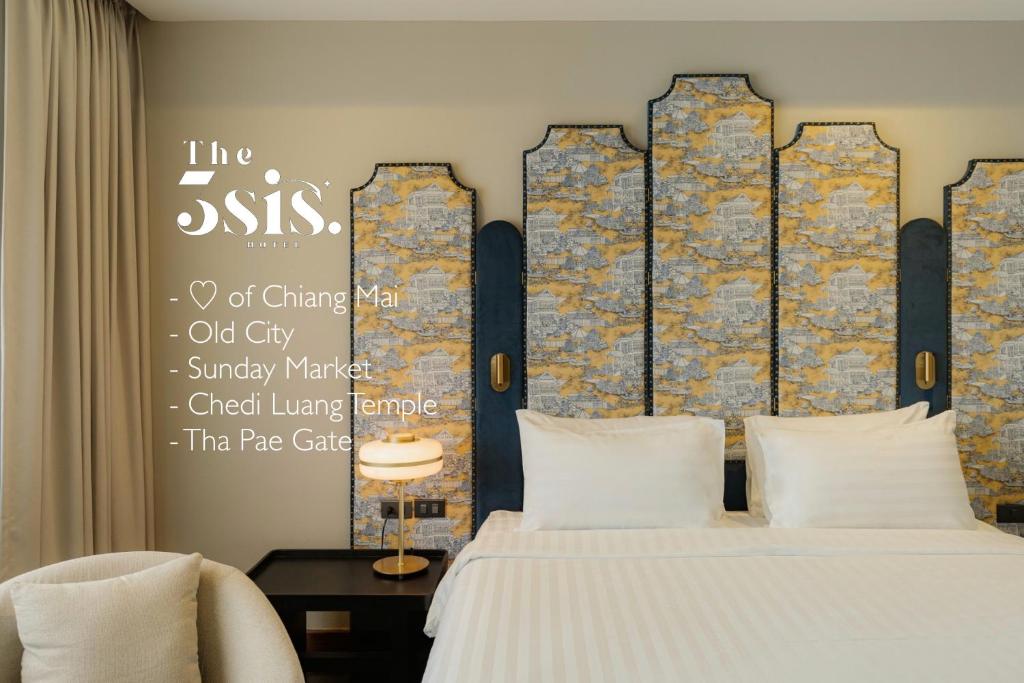 Giường trong phòng chung tại The 3sis Hotel