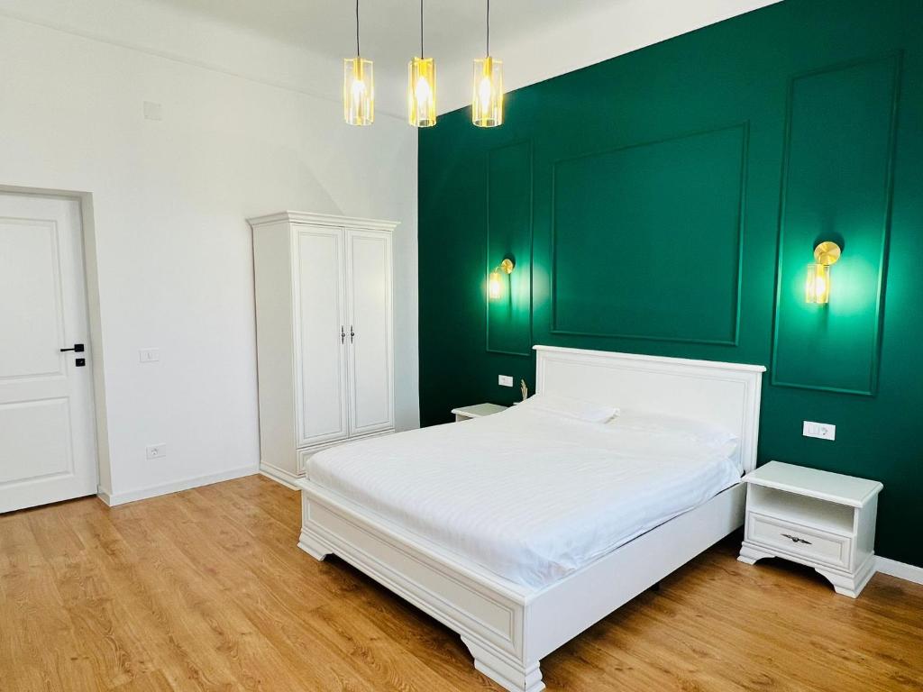 Un pat sau paturi într-o cameră la Sí Apartments Aquapark
