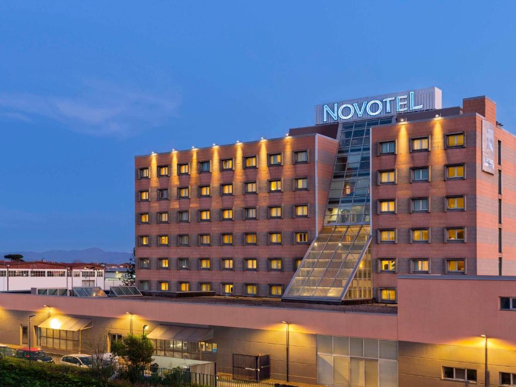 a hotel building with a novation sign on top of it at Novotel Caserta Sud in Caserta