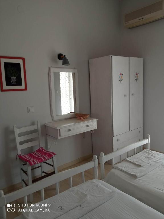 Postel nebo postele na pokoji v ubytování Angelik Ipsos no5