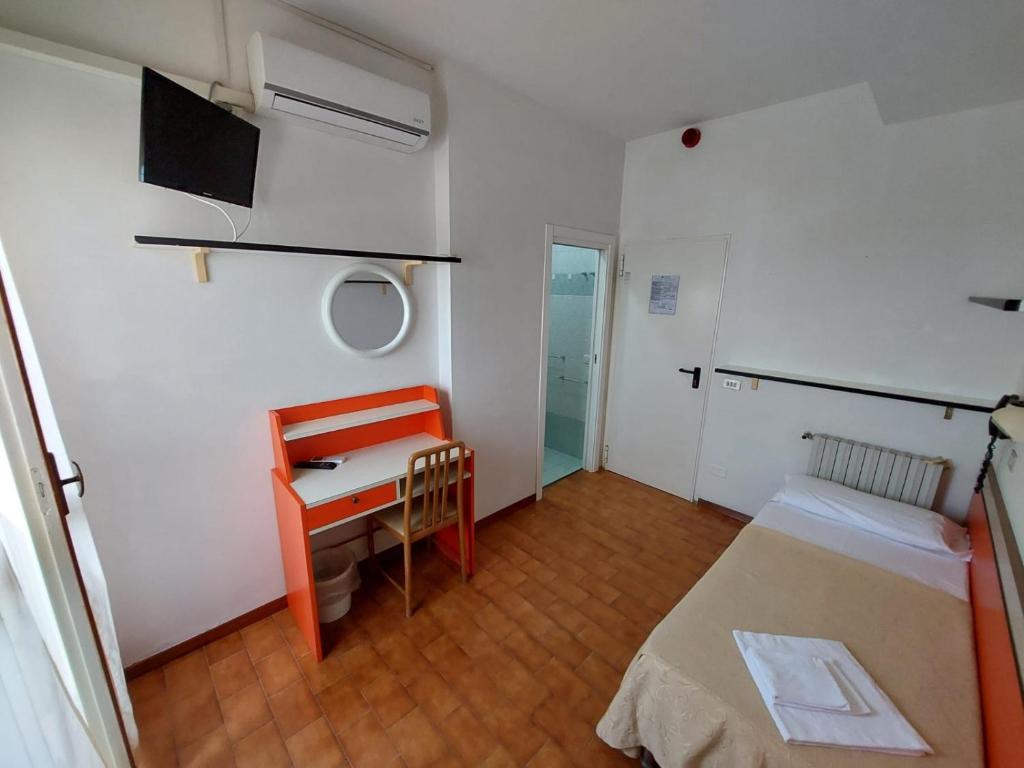 Postel nebo postele na pokoji v ubytování Hotel Zani