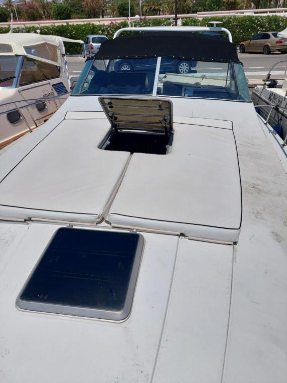 a white truck parked in a parking lot at l ile sur mer in Empuriabrava