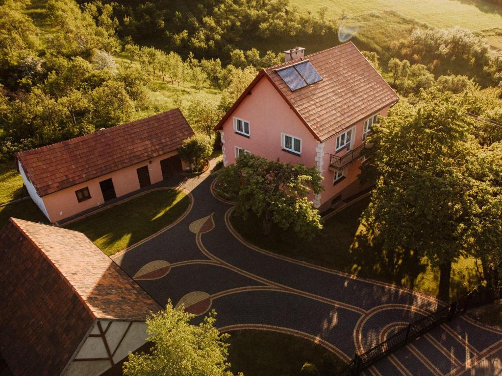an aerial view of a house with a winding road at Dom pod Jabłoniami in Łukowica
