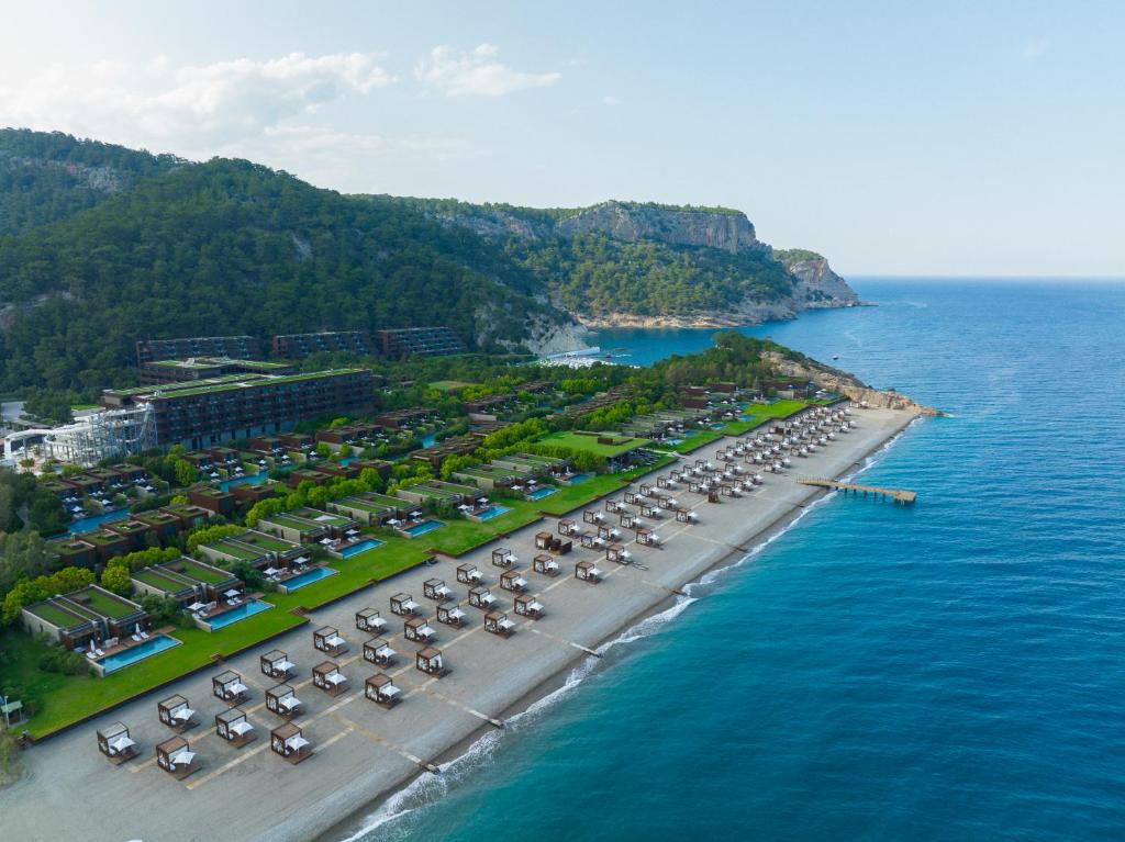 an aerial view of a parking lot next to the ocean at Maxx Royal Kemer Resort in Kemer