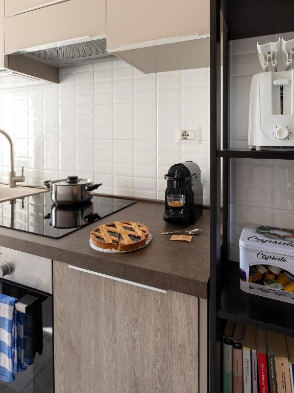 Kuchyň nebo kuchyňský kout v ubytování Cosy flat