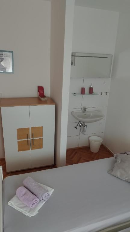 Postel nebo postele na pokoji v ubytování Rooms Hvar