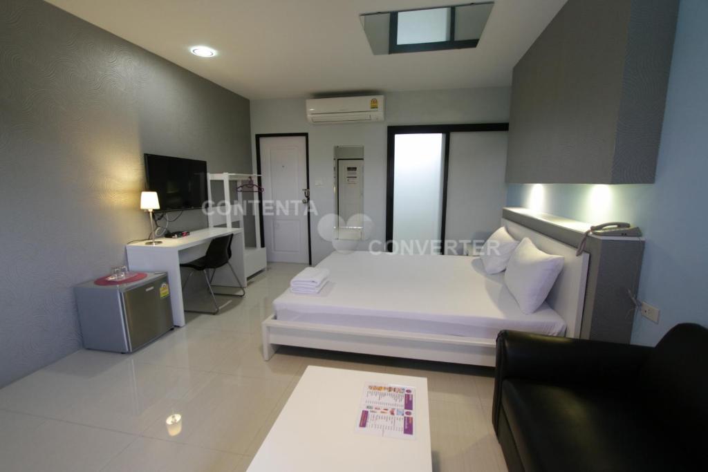 Postel nebo postele na pokoji v ubytování Eazy Motel B.a.n.g.n.a