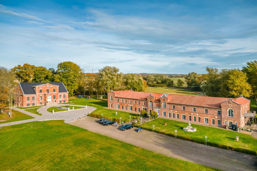 an aerial view of a large brick building at Gut Vorwerk in Sagard