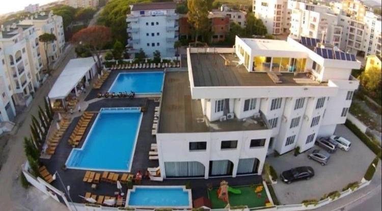 an aerial view of a building with two swimming pools at SunBorn Hotel in Golem
