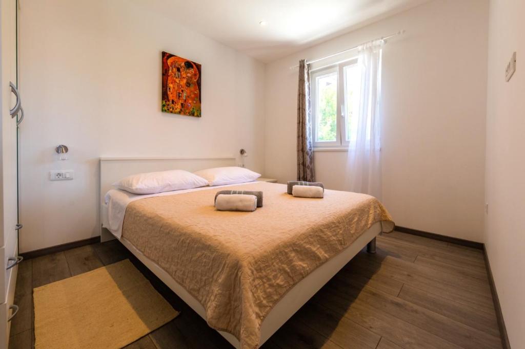 Postel nebo postele na pokoji v ubytování Apartment I&M