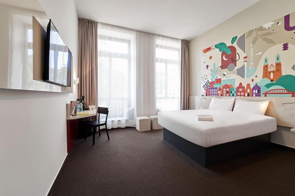 Posteľ alebo postele v izbe v ubytovaní B&B Hotel Poznań Old Town