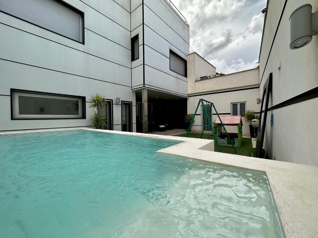 Bazén v ubytovaní KAMA Alojamiento Turístico con piscina privada alebo v jeho blízkosti