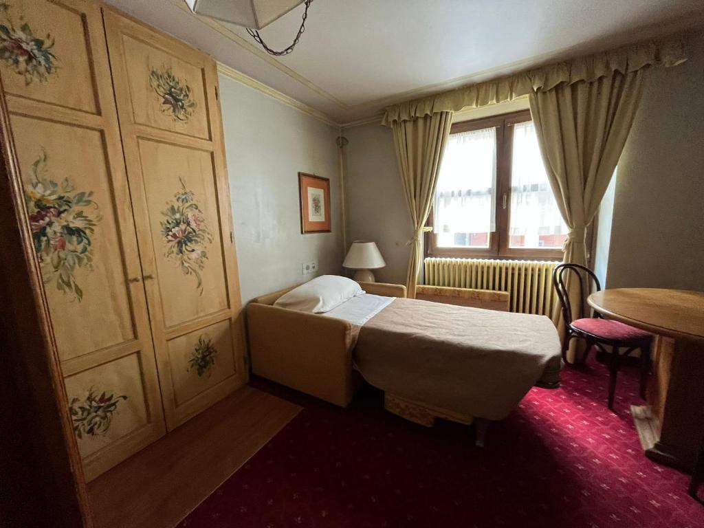 Posteľ alebo postele v izbe v ubytovaní Hotel Posta R.T.A.