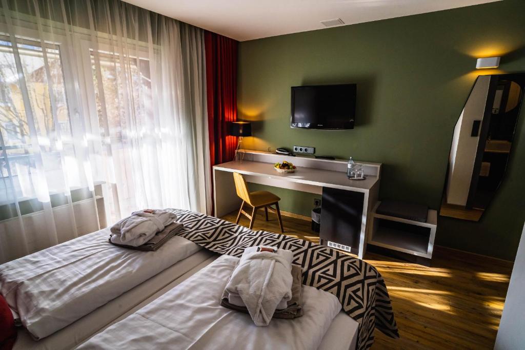 Postel nebo postele na pokoji v ubytování Hotel Alpenblick Kreischberg
