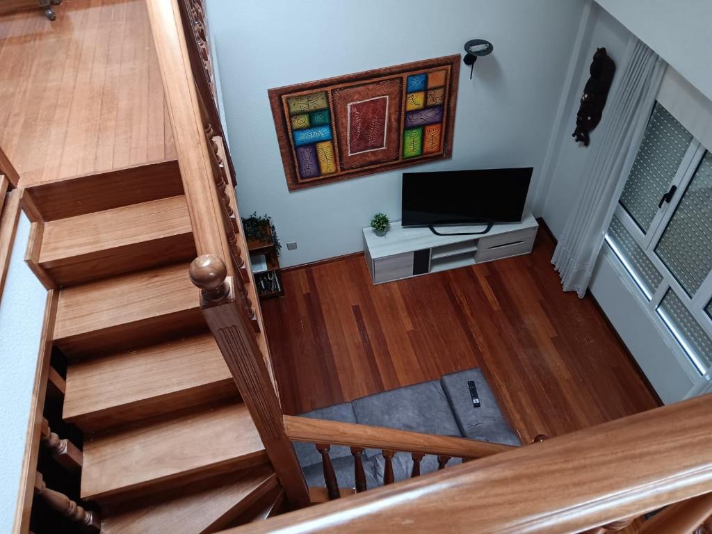 an overhead view of a staircase with a television at Duplex Las Piraguas in Arriondas