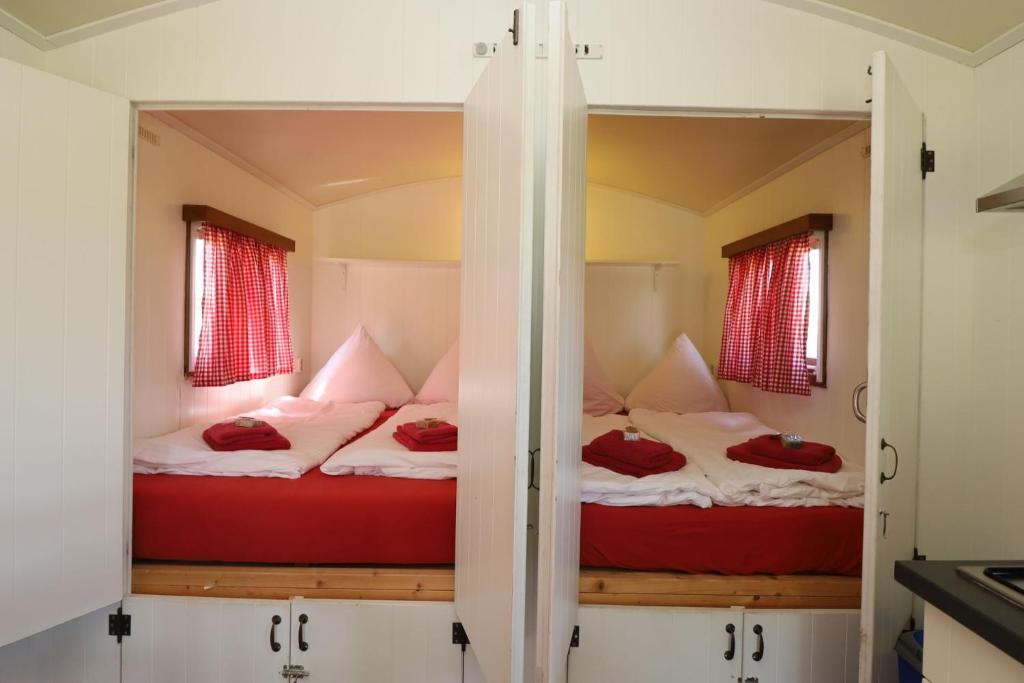 Postel nebo postele na pokoji v ubytování Landgut Voigtsmühle
