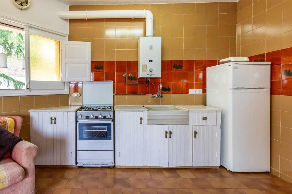 Kuchyňa alebo kuchynka v ubytovaní Cubells 4 Apartamento cercano a la playa