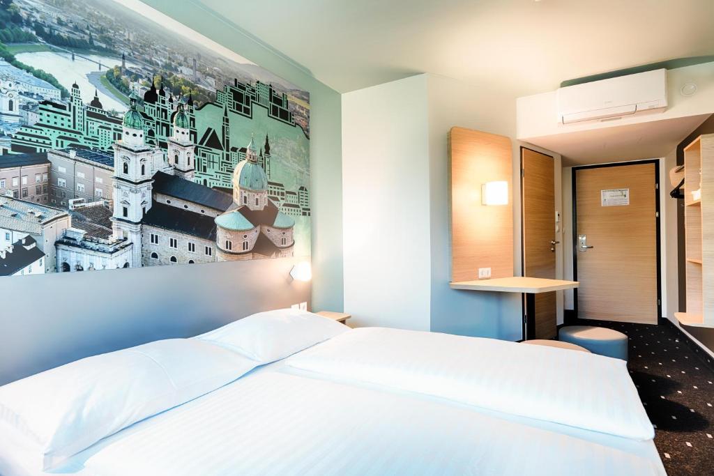 A bed or beds in a room at B&B Hotel Salzburg-Nord