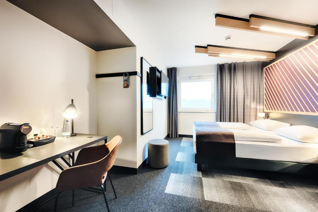 Postel nebo postele na pokoji v ubytování B&B HOTEL Wiesbaden-Hbf