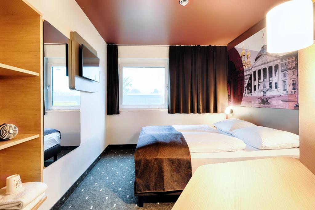 Postel nebo postele na pokoji v ubytování B&B HOTEL Wiesbaden-Hbf