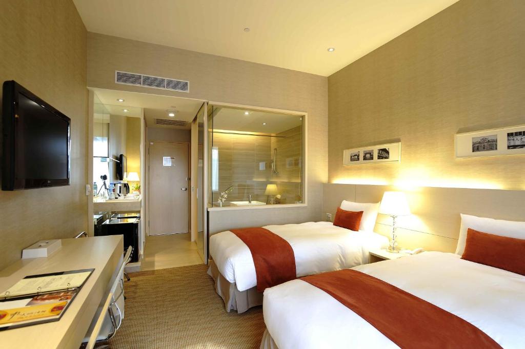 Postel nebo postele na pokoji v ubytování Hotel Riverview Taipei
