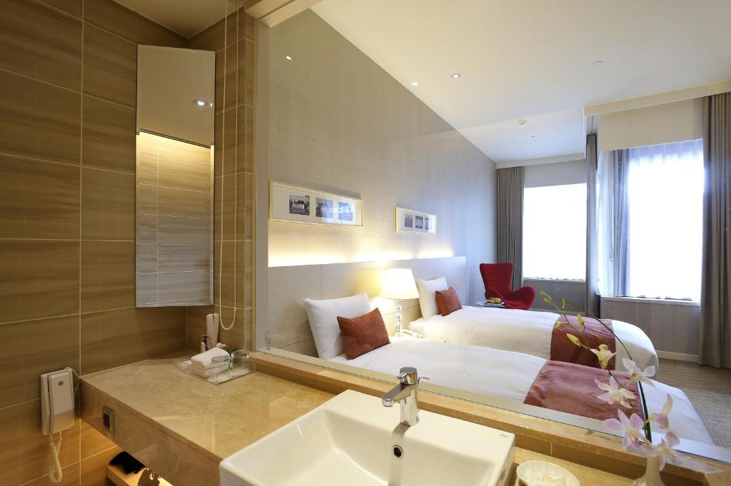 Postel nebo postele na pokoji v ubytování Hotel Riverview Taipei