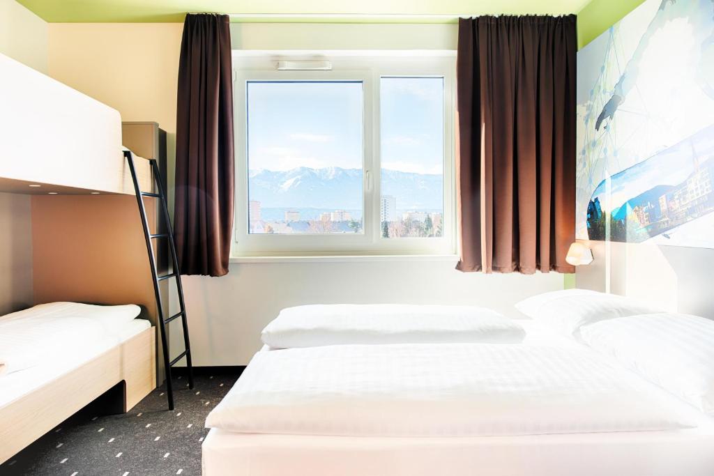 Letto o letti in una camera di B&B Hotel Villach