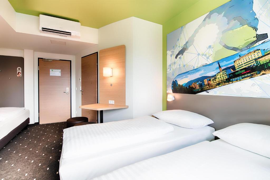 Letto o letti in una camera di B&B Hotel Villach