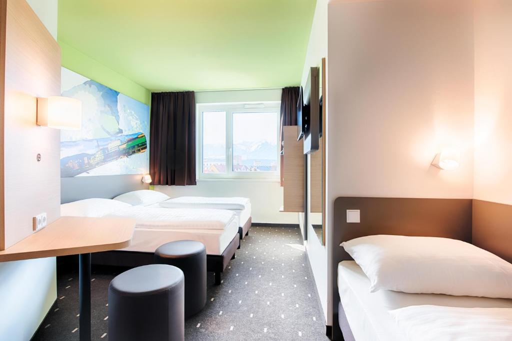 Letto o letti in una camera di B&B Hotel Villach