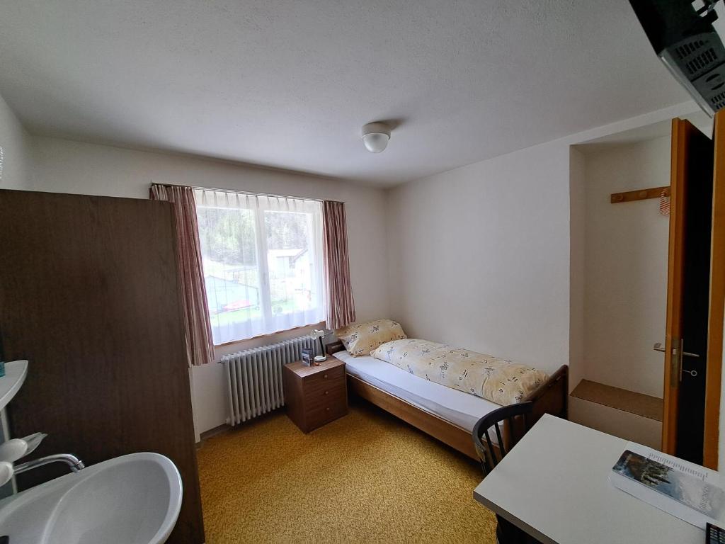 Postel nebo postele na pokoji v ubytování Hotel Posta