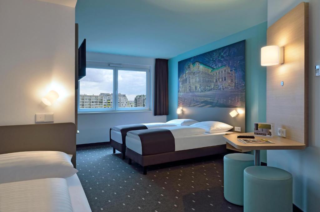 Postel nebo postele na pokoji v ubytování B&B Hotel Wien-Hbf