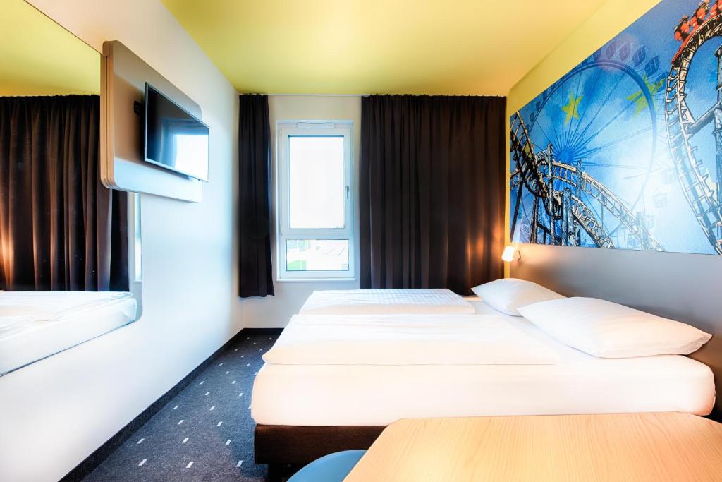 Postel nebo postele na pokoji v ubytování B&B Hotel Rust-Ettenheim
