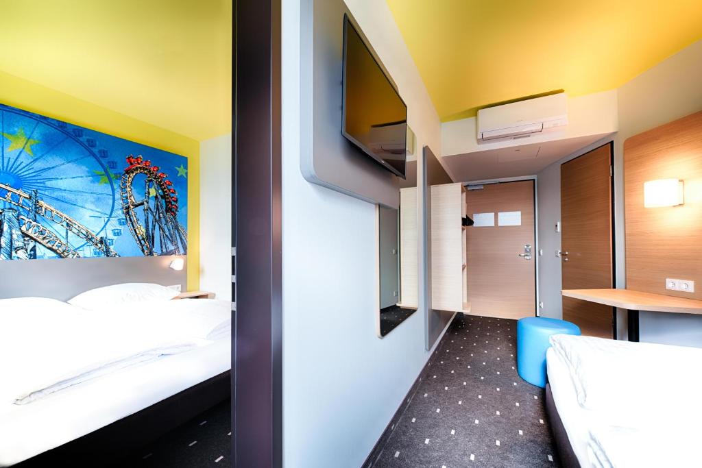 Postel nebo postele na pokoji v ubytování B&B Hotel Rust-Ettenheim