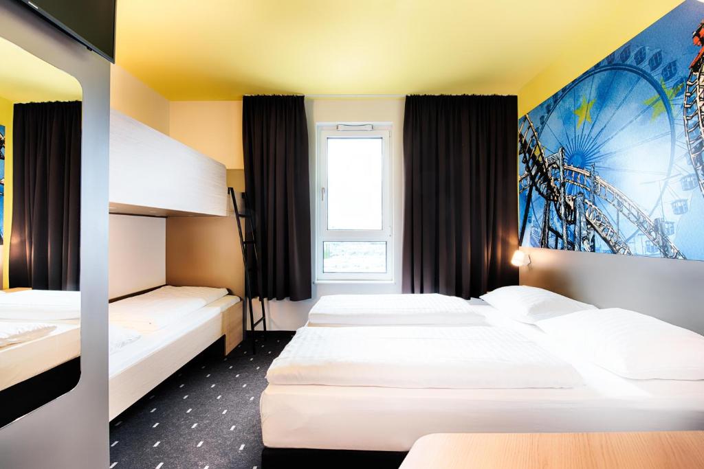 Postel nebo postele na pokoji v ubytování B&B Hotel Rust-Ettenheim