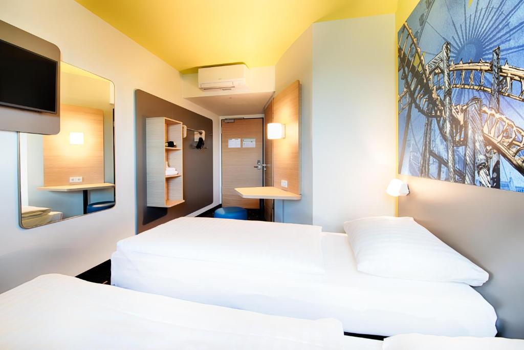 Postel nebo postele na pokoji v ubytování B&B Hotel Rust-Ettenheim