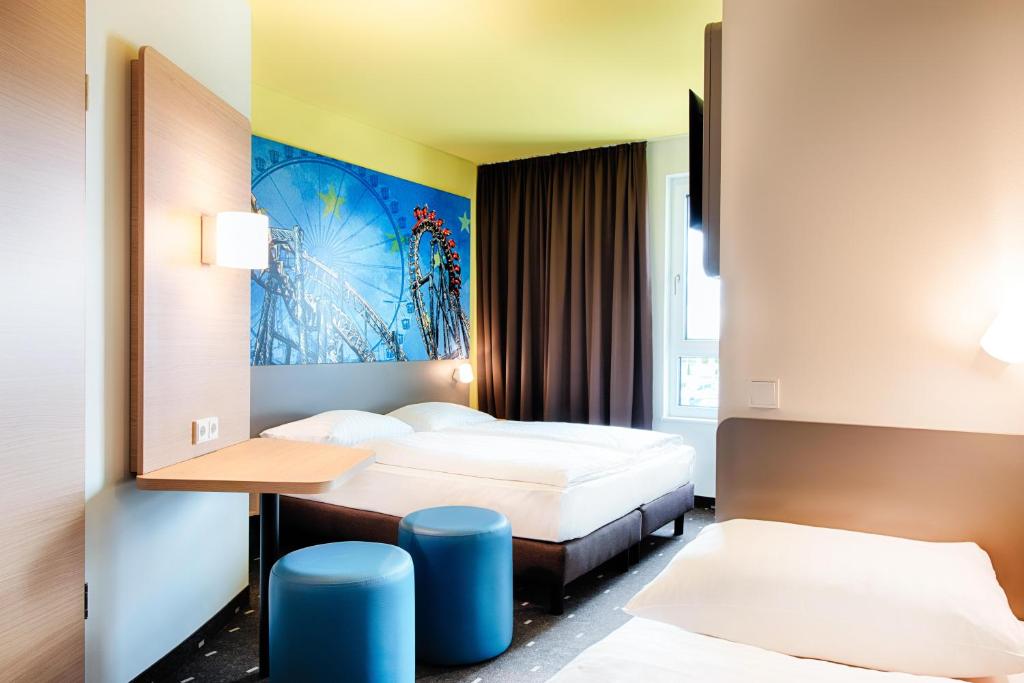 Postel nebo postele na pokoji v ubytování B&B Hotel Rust-Ettenheim