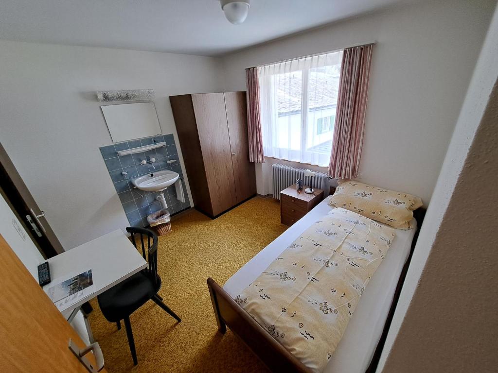 Postel nebo postele na pokoji v ubytování Hotel Posta