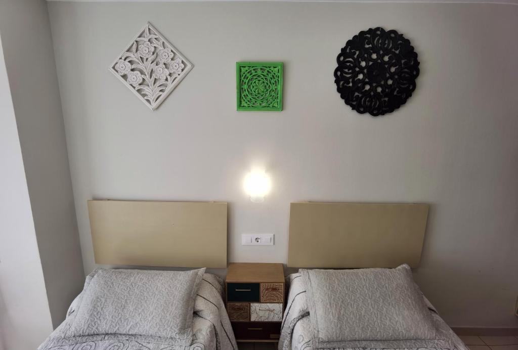 Postel nebo postele na pokoji v ubytování HOSTAL RIGAU