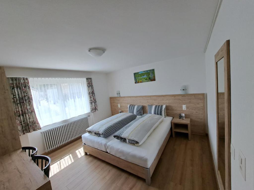 Postel nebo postele na pokoji v ubytování Hotel Posta