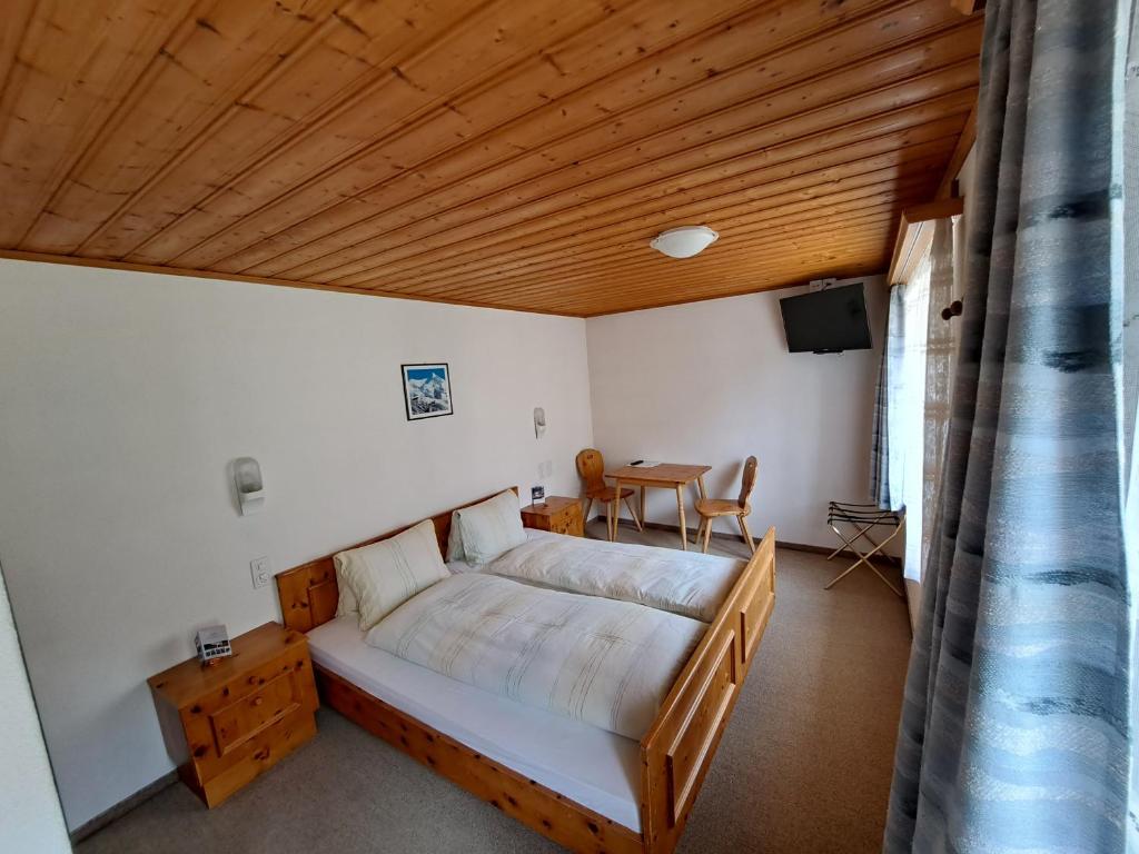 Postel nebo postele na pokoji v ubytování Hotel Posta