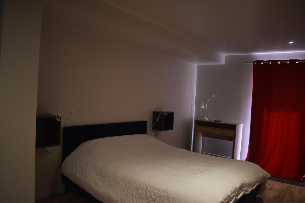 Postel nebo postele na pokoji v ubytování La Cour de l'Olivier
