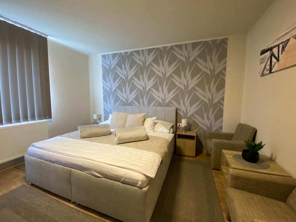 Postel nebo postele na pokoji v ubytování Riviéra Apartmanok