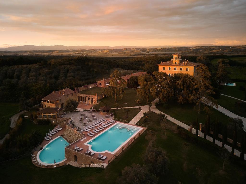 an aerial view of a house with two swimming pools at Precise Tale Poggio Alla Sala in Montepulciano