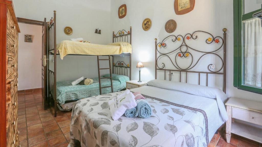 Postel nebo postele na pokoji v ubytování El Algarín La Puebla de Los Infantes by Ruralidays