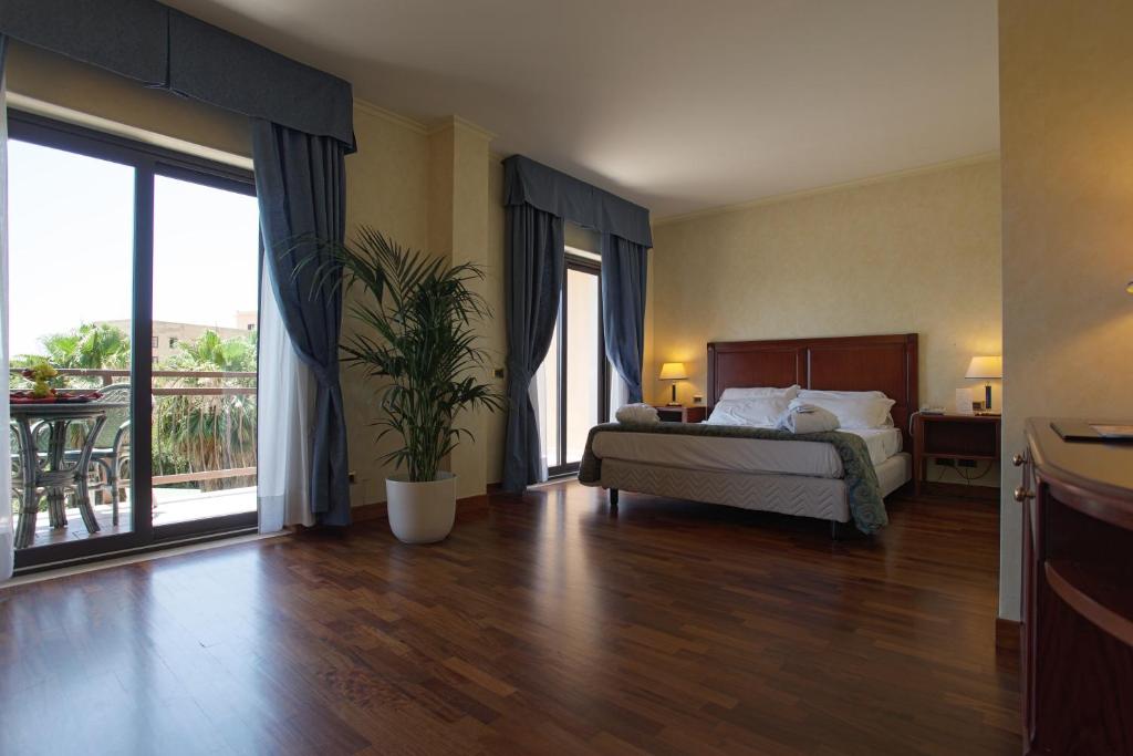 Postel nebo postele na pokoji v ubytování Hotel Della Valle
