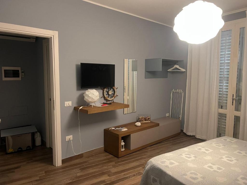 TV o dispositivi per l'intrattenimento presso Le Cale Camera Privata in Residence