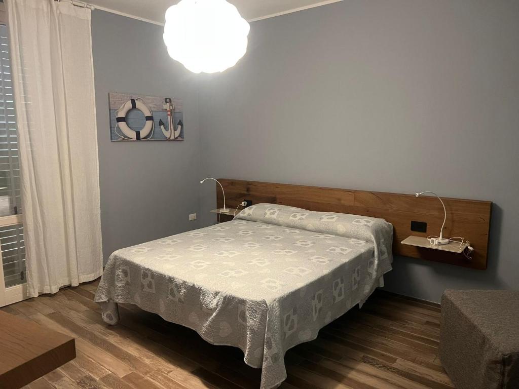 Letto o letti in una camera di Le Cale Camera Privata in Residence