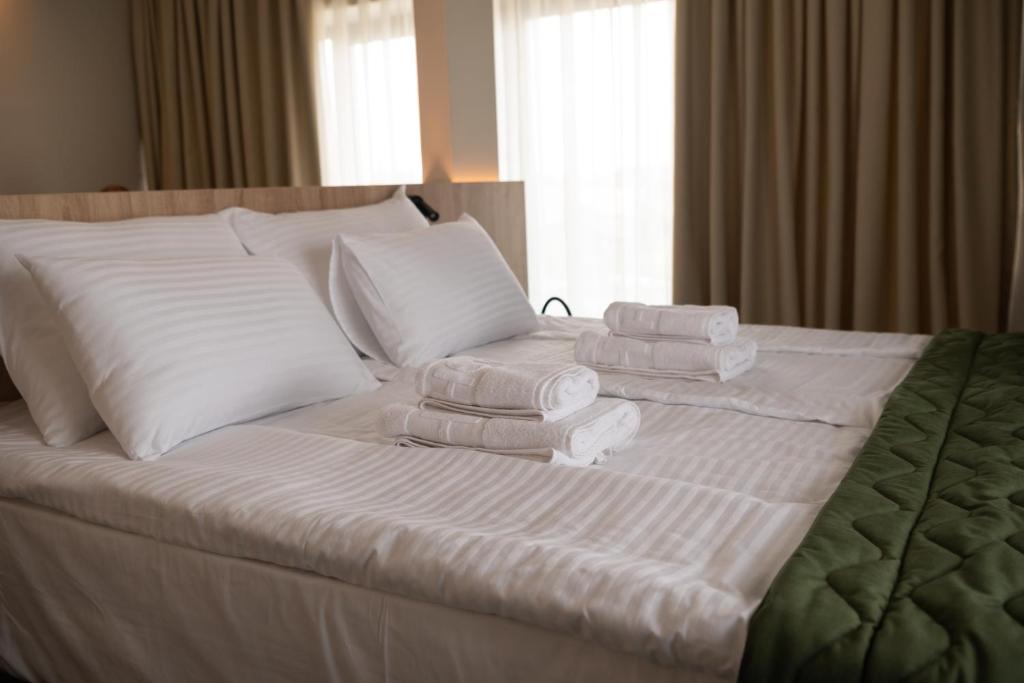 Postel nebo postele na pokoji v ubytování HOTEL GRACIAN